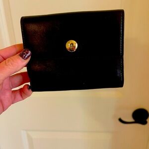Kate Spade wallet.  Black with gold trim. In excellent conditin.